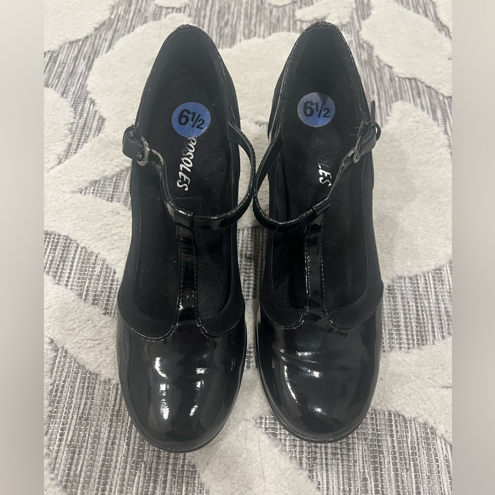 T-strapped patent leather. Worn twice. Great condition.